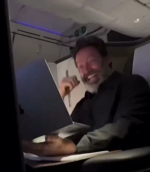 Hugh Jackman Can't Stop Laughing at His Laptop